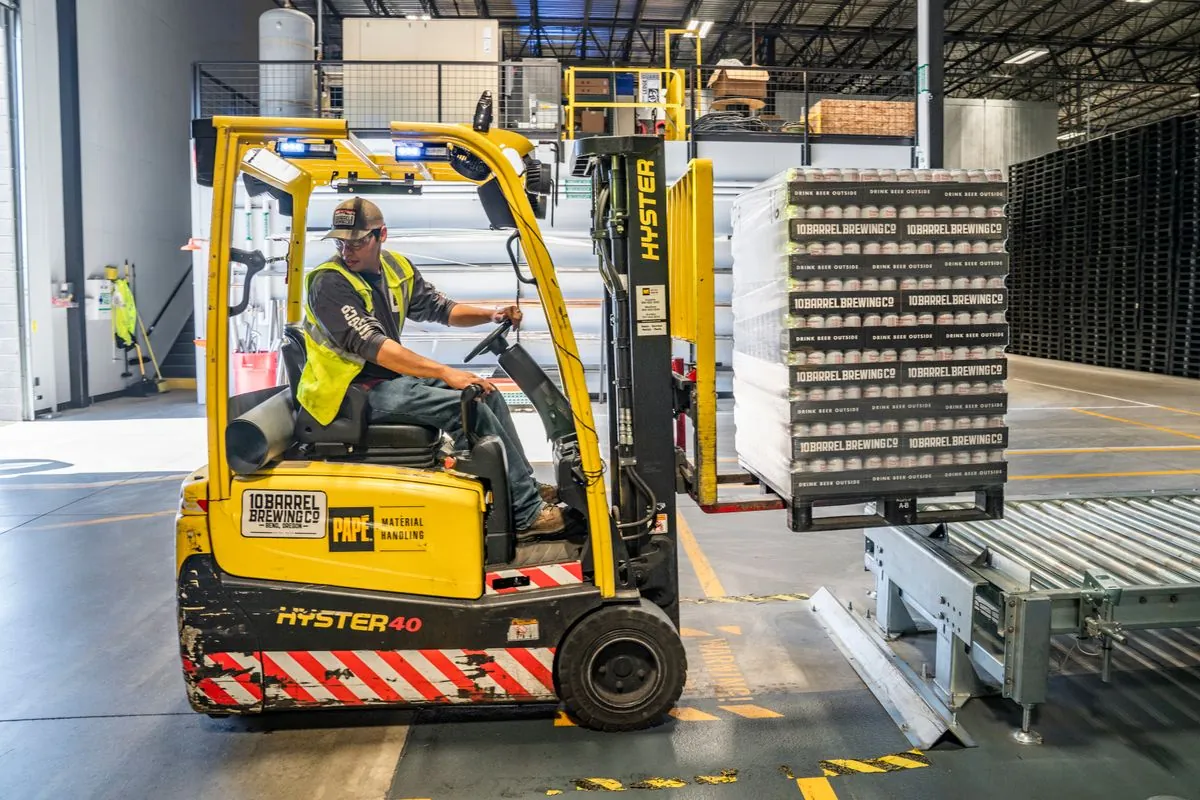 Forklift moving pallets at the cross-dock hub